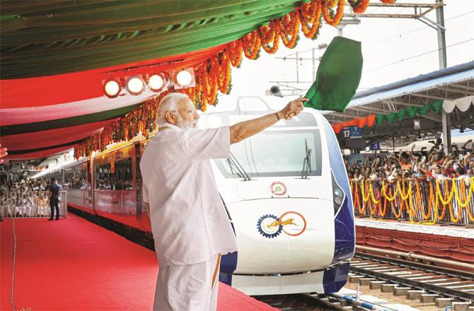 Prime Minister Modi flagging off the Vande Bharat Express. (Photo: PTI)