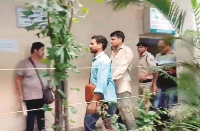 Accused police officer Chetan Singh is being taken to Borivali police station. (Photo: PTI)