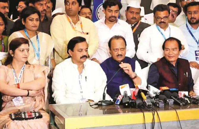 Ajit Pawar addressing the press conference. MP Sunil Tatkare, Dhananjay Munde and others are also seen. Photo: INN