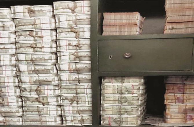 Bundles of currency notes kept in a cupboard at a location in Bhubaneswar. Photo: INN