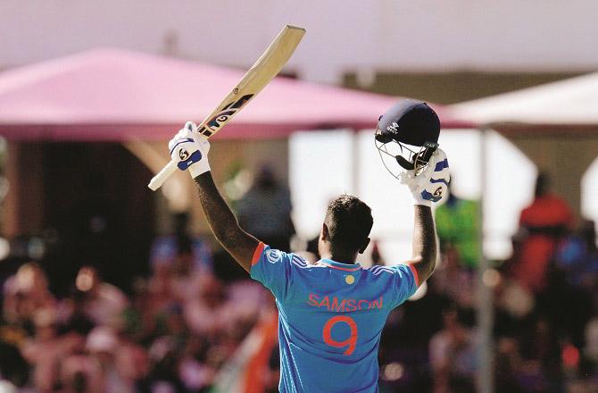 Sanju Samson accepting fans` congratulations after completing his century. Photo: PTI