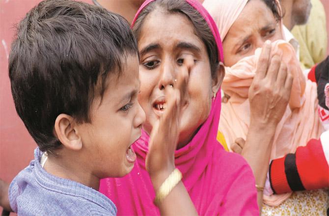 Families of those arrested for child marriage cry outside the police station. (PTI)