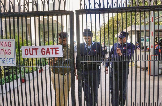 Security personnel locking the main gate of the BBC office in Delhi. (PTI)