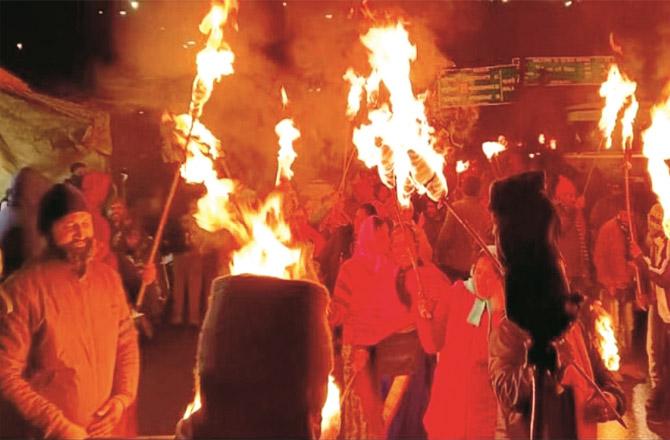 The people of Joshi Mutt during Friday night torch march.