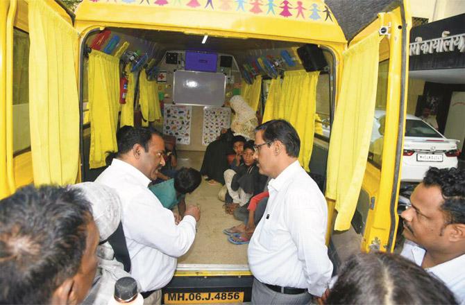 Officials can be seen on the occasion of the inauguration of the `Mobile School Bus` in Thane