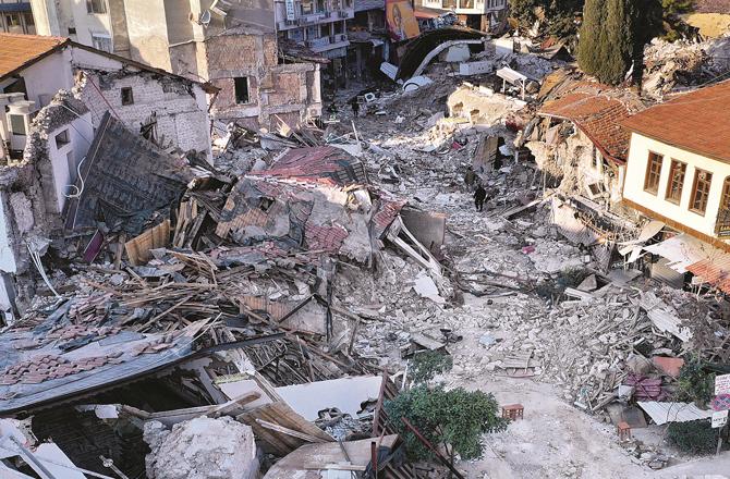 Two children are seen in this photo of the earthquake-stricken area of Syria. (Photos: AP/PTI/Agency)