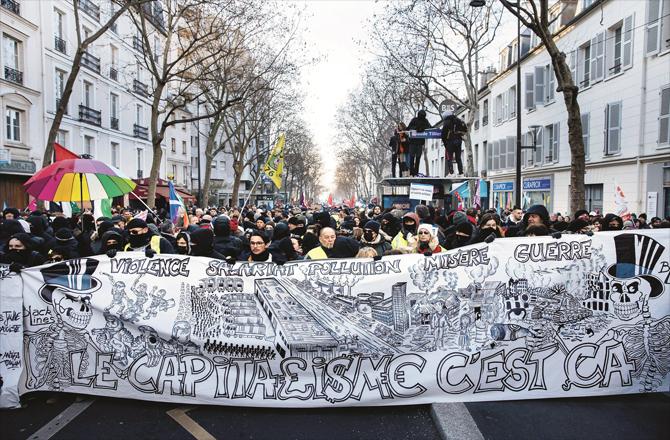 Thousands of people gather on a street in the capital Paris. (AP/PTI)