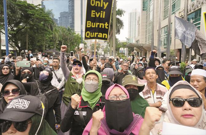 Indonesian citizens are chanting slogans in Jakarta. (AP/PTI)