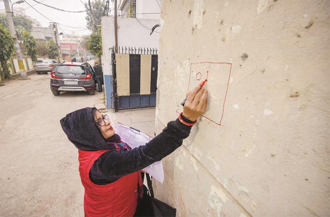 Census officials are putting numbers on the houses to count them. (Photo: PTI)