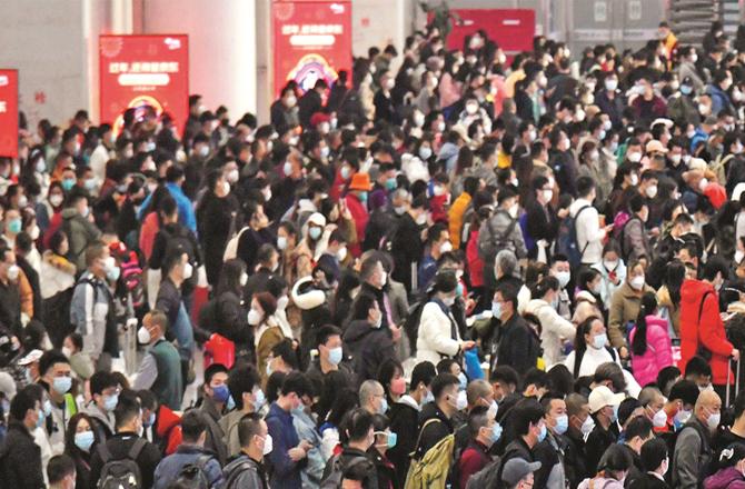 Passengers crowd at a railway station in China; (AP/PTI)