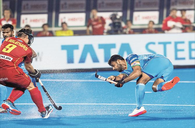 The Indian player can be seen hitting a great shot against Spain