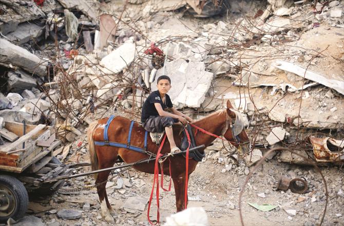 A child is seen riding a horse in Gaza.