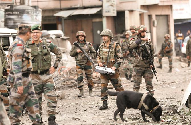 After the blasts in Jammu, the security personnel are looking for clues. (PTI)