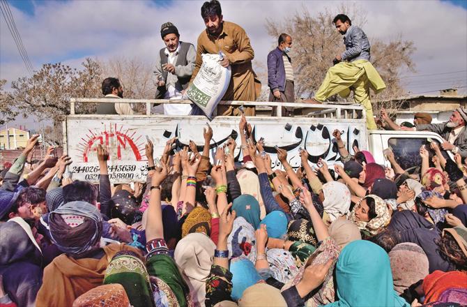 Trying to get cheap flour in Quetta. (AP/PTI)