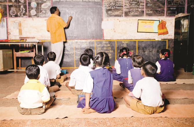 A school in Ratnagiri where only a few children are sitting and studying while most schools have many children on the register.