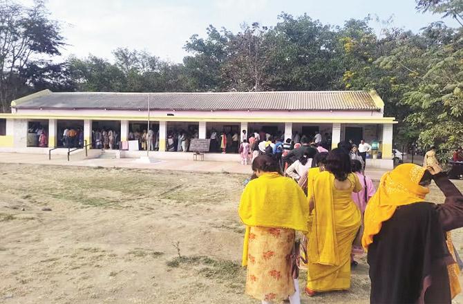 Voters line up at a polling center in Nagpur