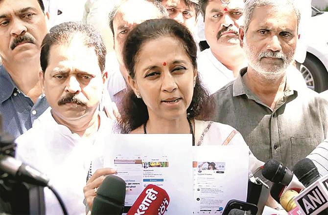 Sharad Pawar`s daughter and Member of Parliament Supriya Sule talking to the media after filing the complaint