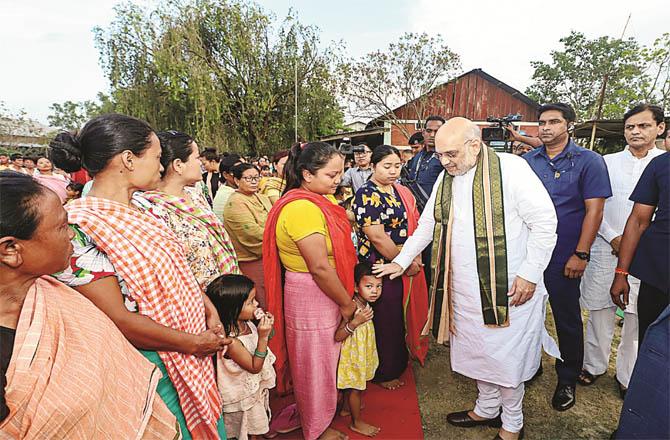 Amit Shah visiting the victims at the relief camp of Meiti community in Imphal