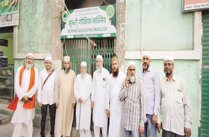 Members of the trustees, Muhammad Saeed Noori and others outside the Ghousia Mosque in Thakurolij.