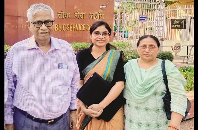 Zufshan with his parents outside the UPSC headquarters.