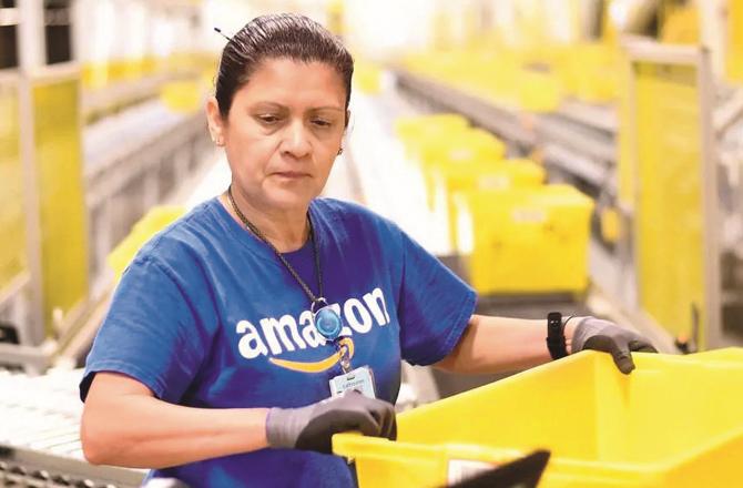 An employee works in Amazon`s storage. (File Photo)