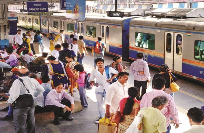 Passengers of general local trains have to wait a long time due to AC local trains. (file photo)
