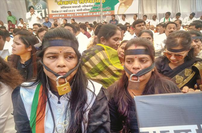 In Madhya Pradesh, Congress supporters can be seen protesting with facelocks as a sign of silence.