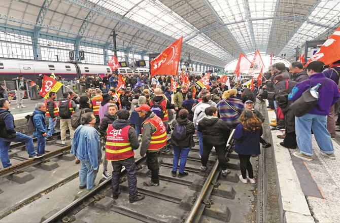 Protesters shouting slogans at a railway station. (Photo: PTI)