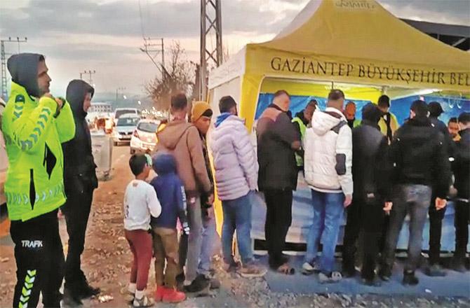 The plight of Turkey`s victims, who were once prosperous, can now be seen queuing for food.
