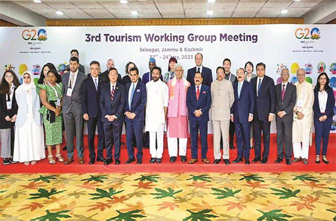 On the second day of the third meeting of the `Tourism Working Group`, the delegates took a group photo after the meeting ended (Photo: PTI)