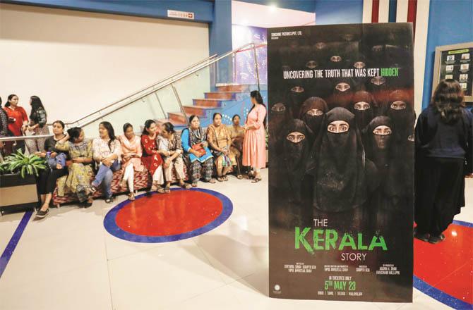 Women sitting in a queue to watch a film in Gujarat, special arrangements are being made for the screening of the controversial film `The Kerala Stowe` in BJP-ruled states (Photo: PTI)