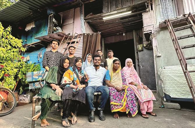 Syed Muhammad Hussain Ramzan Outside UPSC Headquarters. Left: With the family outside the house.