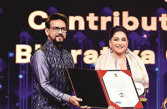 Madhuri Dixit with Anurag Thakur. Photo: PTI