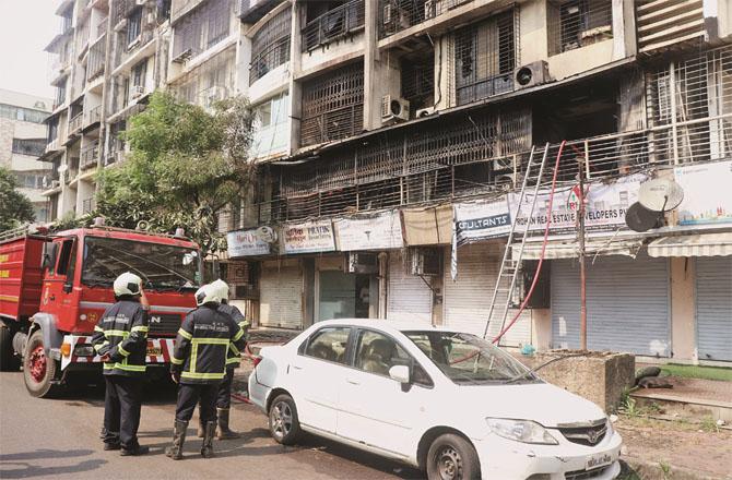 Firemen can be seen near the building. Photo: Anurag Ahire