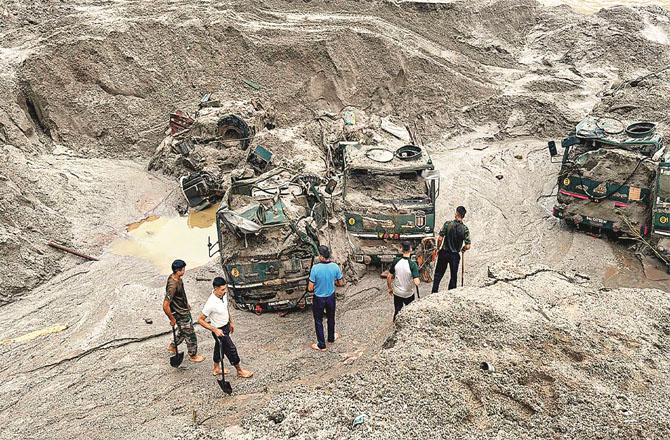 Many army vehicles were washed away due to floods in Sikkim. Photo: PTI