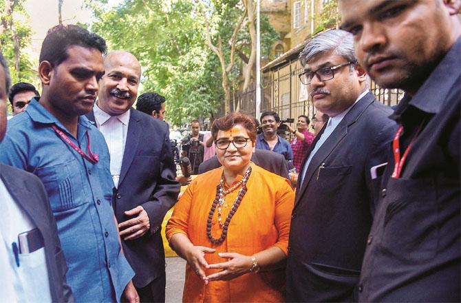 Pragya Thakur with her lawyers outside the court. (File Photo)