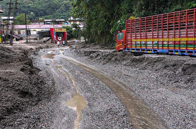 Truck debris is stuck in the mud in North Sikkim. Photo: PTI