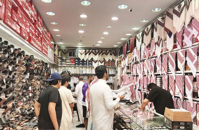 People shopping in a local market in Tabuk. Tabuk is the name of a region in the north of Hijaz between Wadi Quri and Syria.