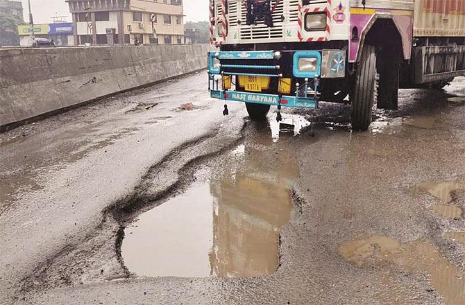 Due to huge potholes on the flyover, motorists face problems. Photo. INN