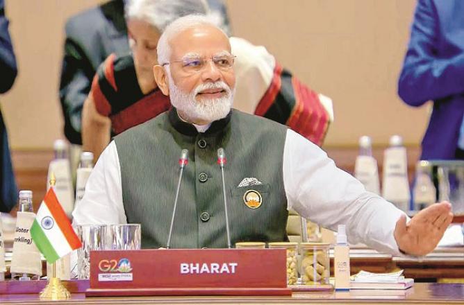 This is probably the first time that `Bharat` has been written instead of `India` on the nameplate of the Prime Minister at a global event. Photo: INN