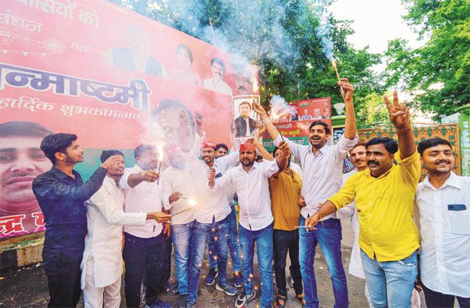 Samajwadi workers celebrating after victory in Ghosi seat
