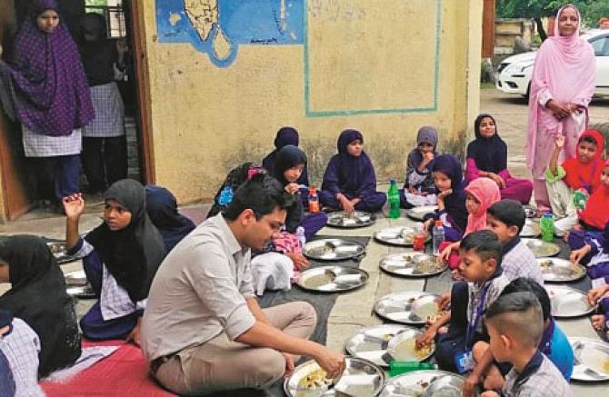 Zilla Parishad CEO Shobham Gupta among the students of Zilla Parishad Urdu School. Photo: INN