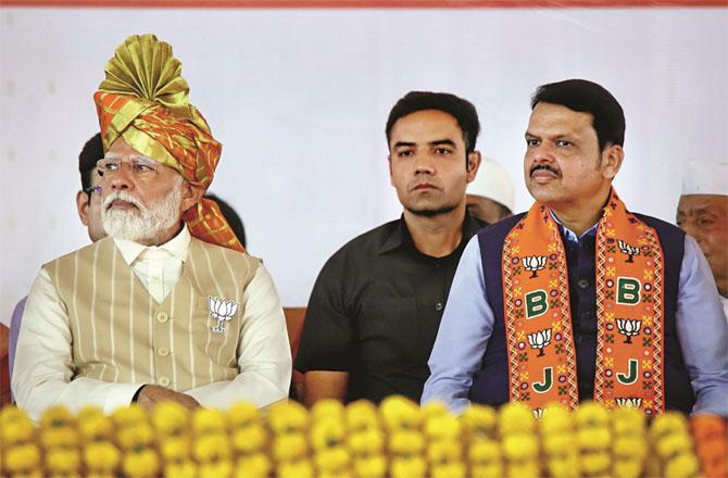 Devendra Farnavis and Prime Minister Modi during a rally in Kolhapur. Photo: INN