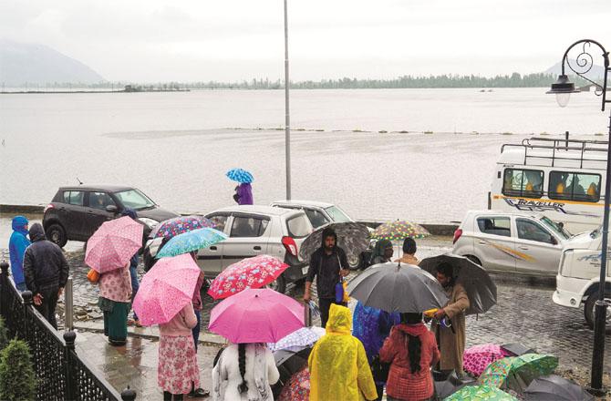 Tourists are stranded at one place in Srinagar due to heavy rain. (PTI)