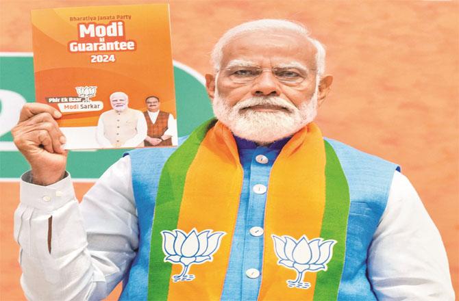 Prime Minister Modi releasing the election manifesto. Photo: INN