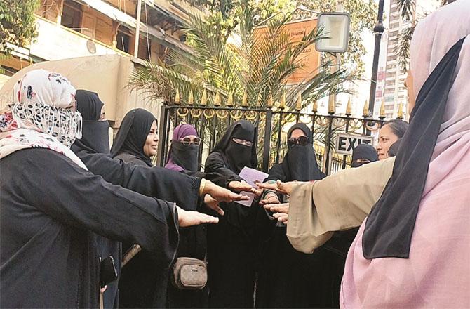 During the voter awareness campaign, women are being sworn in for the right to vote near Zainab Tower.