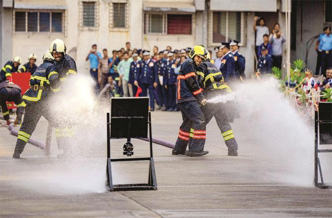 A competition between fire crews was held in Mumbai on Tuesday. Photo: PTI