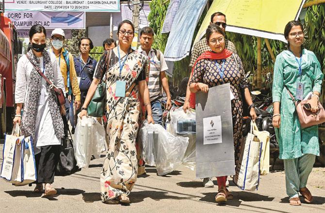Polling officers with EVMs in West Bengal`s South Dinajpur constituency. Photo: PTI