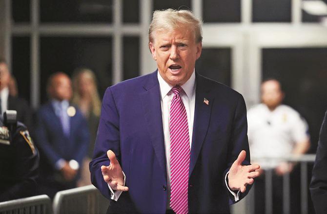 Donald Trump addresses the media outside the courthouse. Photo: AP/PTI