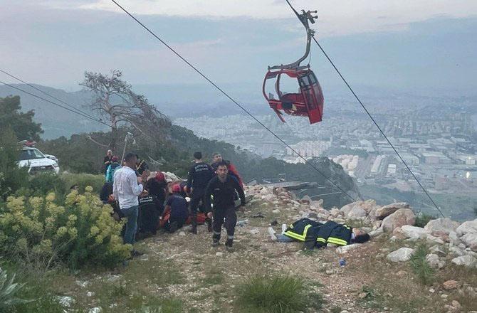 Rescue workers are rescuing people trapped in the cable car. Photo: PTI